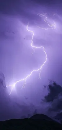 Looking for a dramatic live wallpaper for your phone? Look no further than this lightning bolt atop a purple sky backdrop