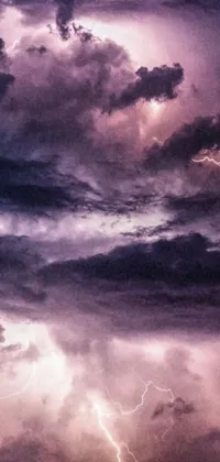 This live phone wallpaper features a magnificent digital art image of a sky filled with clouds and lightning
