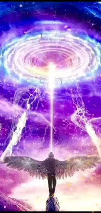 This phone live wallpaper showcases a striking scene of a man standing on a green field while purple fire powers swirl around him