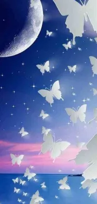 This live phone wallpaper showcases graceful white butterflies fluttering in a vibrant blue sky, set against a backdrop of twinkling stars and crescent moons for a magical effect