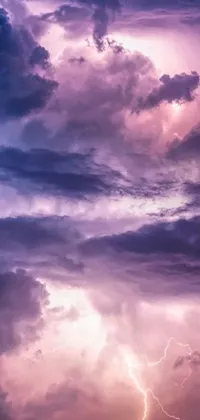This phone live wallpaper features a stunning sky filled with clouds and lightning in shades of purple for a moody effect