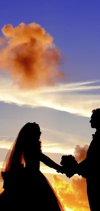 This live phone wallpaper showcases a charming silhouette of a bride and groom holding hands with a dreamy sunset sky backdrop
