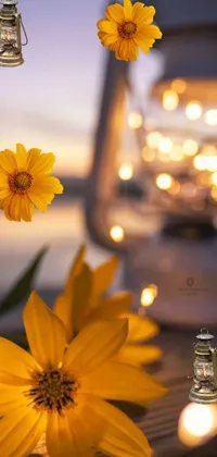 This phone live wallpaper features a charming scene of yellow flowers on a wooden table by Nándor Katona