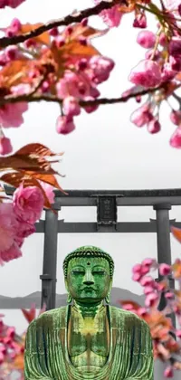 This phone live wallpaper showcases a serene green buddha statue surrounded by delicate pink flowers in the style of ukiyo-e