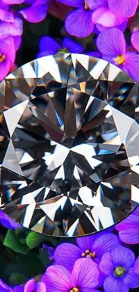 This phone live wallpaper features a stunning close-up of a diamond surrounded by purple flowers