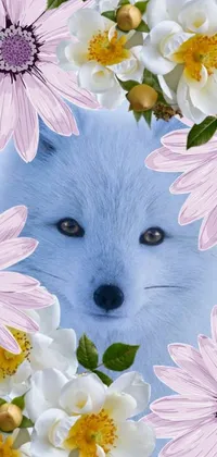 This phone live wallpaper showcases a stunning image of a blue fox enclosed by a mesmerizing background of pink and white flowers, symbolizing the changing of seasons