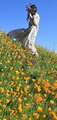 This phone live wallpaper showcases a woman walking through a field of flowers in central California