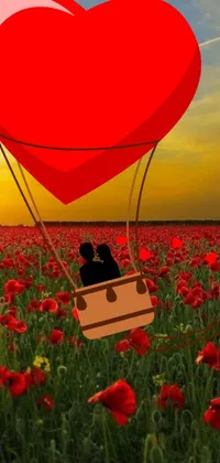 This phone live wallpaper features a romantic and scenic view of a colorful field of flowers, with a couple aboard a hot air balloon looking lovingly at each other