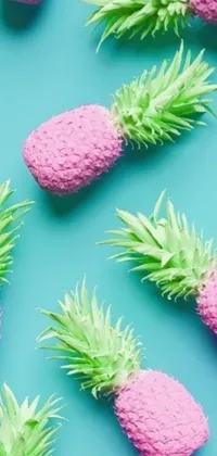 This lively live wallpaper features a cheerful group of pink and green pineapples with spikes and leaves rendered in 3D