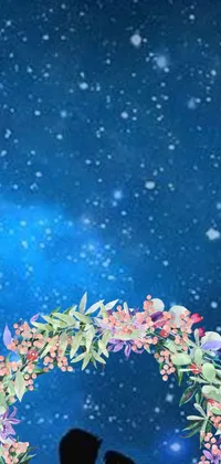 This phone live wallpaper showcases a beautiful couple standing in front of a blue sky, all wrapped up in a lovely array of flowers and berries