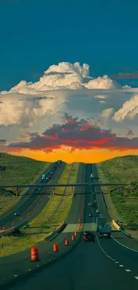 This phone live wallpaper features a highway at sunset with a cloudy sky, ideal for adventurous souls