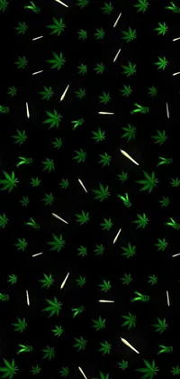 This live phone wallpaper features a vibrant pattern of marijuana leaves on a black background, creating a striking contrast that is sure to catch the viewer's eye