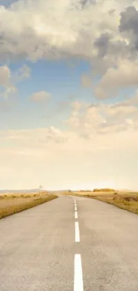 This live wallpaper features a calming scene of an empty road stretching far into the horizon, set against a vibrant blue sky