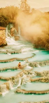 Looking for a stunning live phone wallpaper that will transform your phone into a work of Renaissance art? This one features a man standing in a serene pool of water amidst staggered terraces and lush vegetation that's captured in brilliant natural morning light