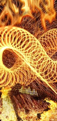This live wallpaper depicts a digital art of a fire spinning in the air, showing a giant coiling snake machine that seems to create a corgi made of fire