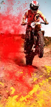 This phone live wallpaper offers a breathtaking scene of a dirt bike rider tearing through a dusty road