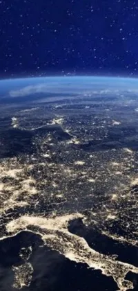 This stunning live wallpaper showcases a breathtaking view of the planet Earth at night seen from space