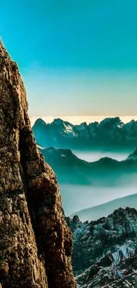 This live wallpaper depicts a picturesque scene of a group of people standing on top of the Dolomites mountain range in the Italian Alps
