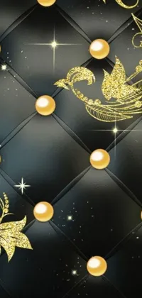 Looking for a stunning live wallpaper to enhance your phone? Look no further than this eye-catching black and gold quilt adorned with shimmering pearls and stars