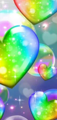 This live wallpaper for your phone showcases a delightful display of colorful hearts set against a dreamy backdrop of rainbow bubbles