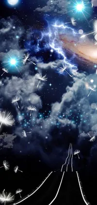 This phone live wallpaper depicts a magical night sky full of stars and dandelions