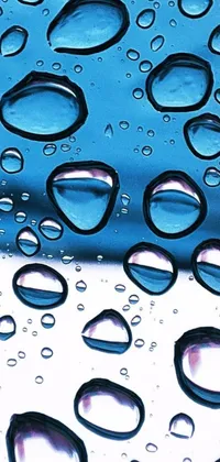 This stunning live wallpaper showcases a macro photograph of water droplets on a surface, displaying incredible photorealism