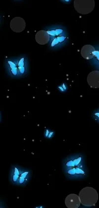 This live wallpaper depicts a beautiful group of Blue Butterflies fluttering against a black background, sourced from DeviantArt