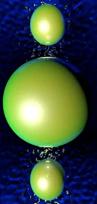 This phone live wallpaper features a visually striking image of three green balls floating on a blue water surface, designed exclusively using digital art techniques