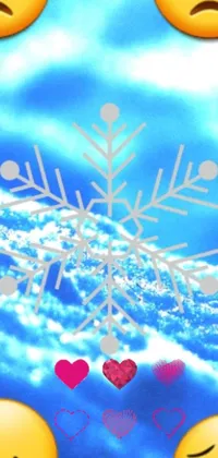 This phone live wallpaper features a colorful and lively design with cute emoticons and delicate snowflakes against a soft blue and white background