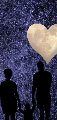 This romantic live phone wallpaper features a heart and a couple holding hands, set against a stunning night sky with Saturn and a supermoon in the background