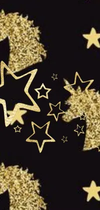 This phone live wallpaper features a dazzling array of gold glitter stars and unicorns set against a solid black backdrop