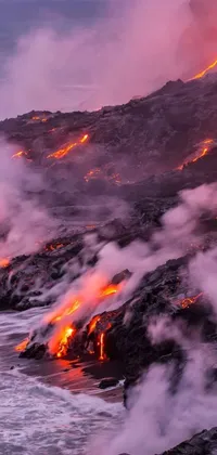 This live phone wallpaper showcases a breathtaking view of lava flowing into the ocean from a volcanic eruption
