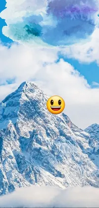Decorate your phone with this stunning live wallpaper featuring a cute smiley face balloon drifting gracefully over a mountain covered in snow