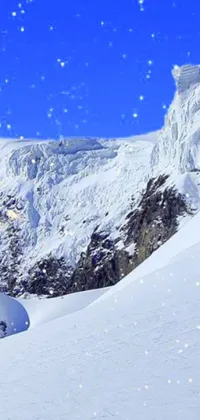 If you're a fan of winter sports, you'll love this phone live wallpaper featuring a snowboarder carving his way down a snow-covered slope