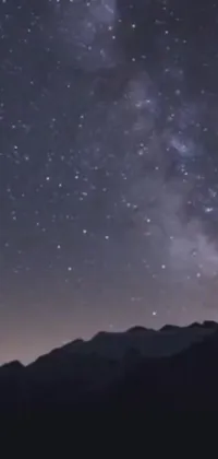 Transform your phone's display with a breathtaking live wallpaper featuring a starlit night sky