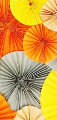 This phone live wallpaper features a dynamic design of colorful paper fans arranged in a circular pattern