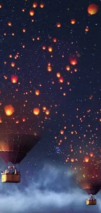 Get mesmerized by this phone live wallpaper featuring a group of hot air balloons floating across a starry sky while illuminated by torchlights