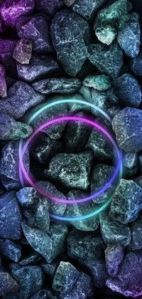 This phone live wallpaper depicts a ring balancing on rocks in a digital art rendition