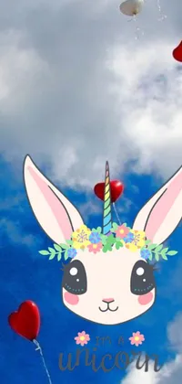 This live phone wallpaper features an adorable bunny floating amidst colorful balloons in a beautiful blue sky