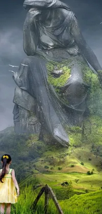 This phone live wallpaper showcases a girl in a yellow dress standing near a statue in front of a moss-covered ruined temple
