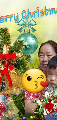 This Christmas-themed phone live wallpaper features a warm and inviting scene of a man holding a baby next to a decorated tree