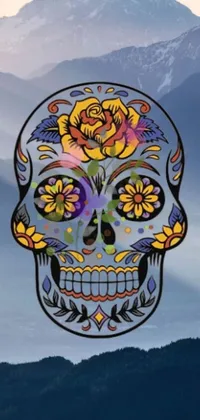 This live wallpaper for your phone features a colorful sugar skull and mountain background, with flowers and sticker art accents