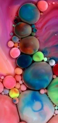 This phone live wallpaper features a collection of vibrant and colorful bubbles floating on your screen