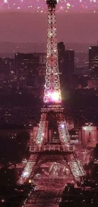 This stunning phone live wallpaper showcases the illuminated Eiffel Tower at night, radiating a soft pink hue