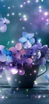 This gorgeous phone live wallpaper features an elegant cup filled with stunning purple and blue flowers