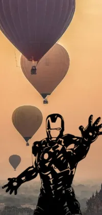 This animated wallpaper showcases a colorful scenery with a bunch of hot air balloons and a superhero portrait