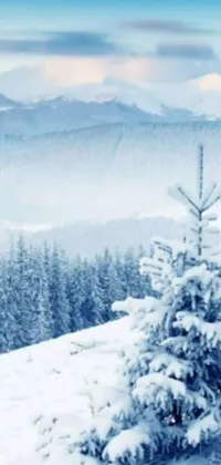 This live wallpaper features a snow-covered tree on a slope, with snow falling in the background