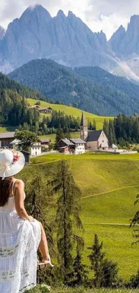 This enchanting phone live wallpaper features a woman in a white dress resting on a bench set against the picturesque Dolomite mountain backdrop