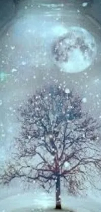 This phone live wallpaper showcases a charming snow globe with a striking tree standing tall inside of it