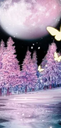 This stunning phone live wallpaper features a beautiful snowy forest at night with a bright full moon shining in the background